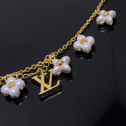 LOUIS VUITTON LOGO 6 MOTIF STAR AND SUN GOLD BRACELET