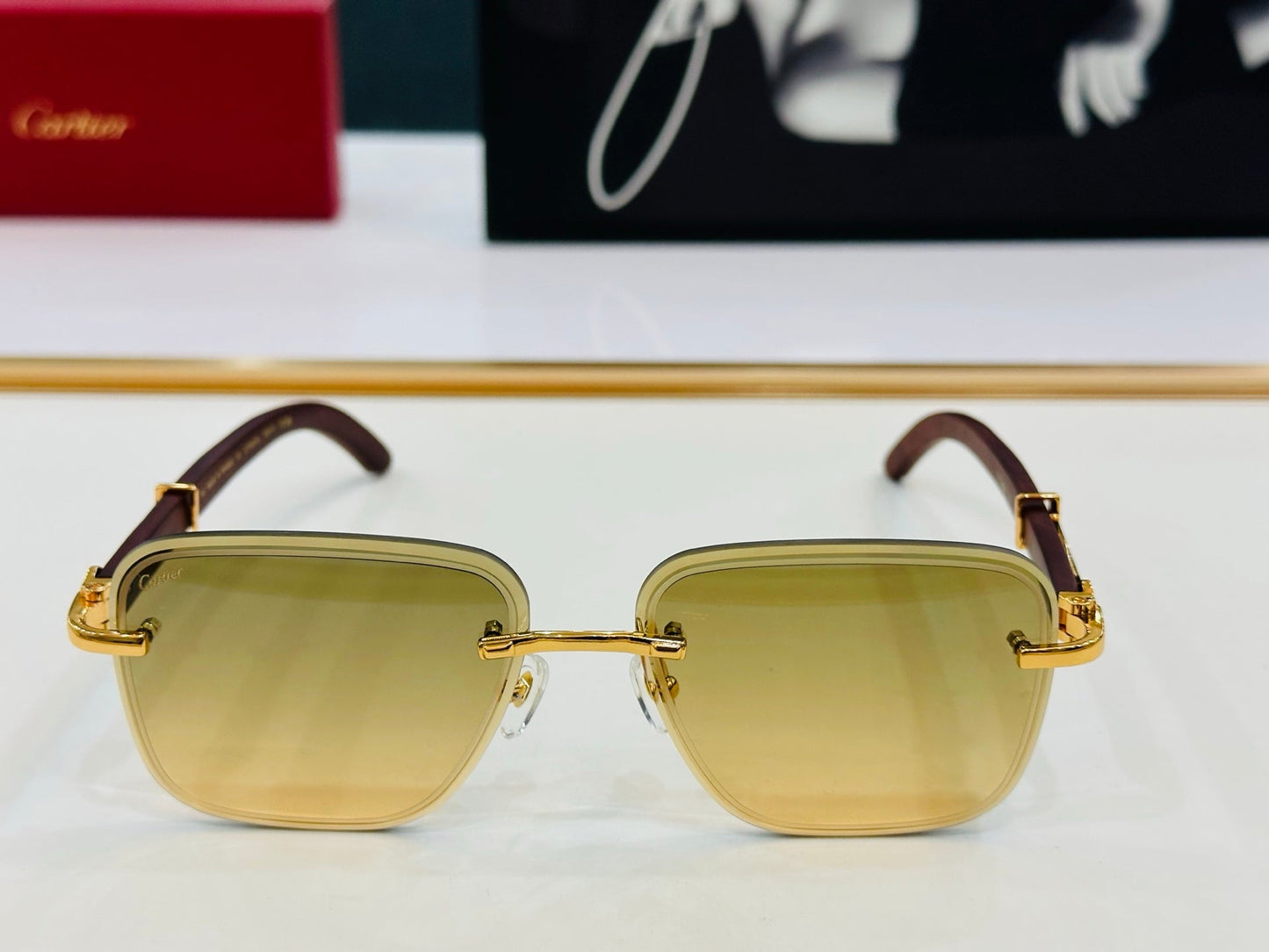 CARTIER RIMLESS RECTANGULAR FRAME SUNGLASSES CT0607S IN METAL AND WOODEN