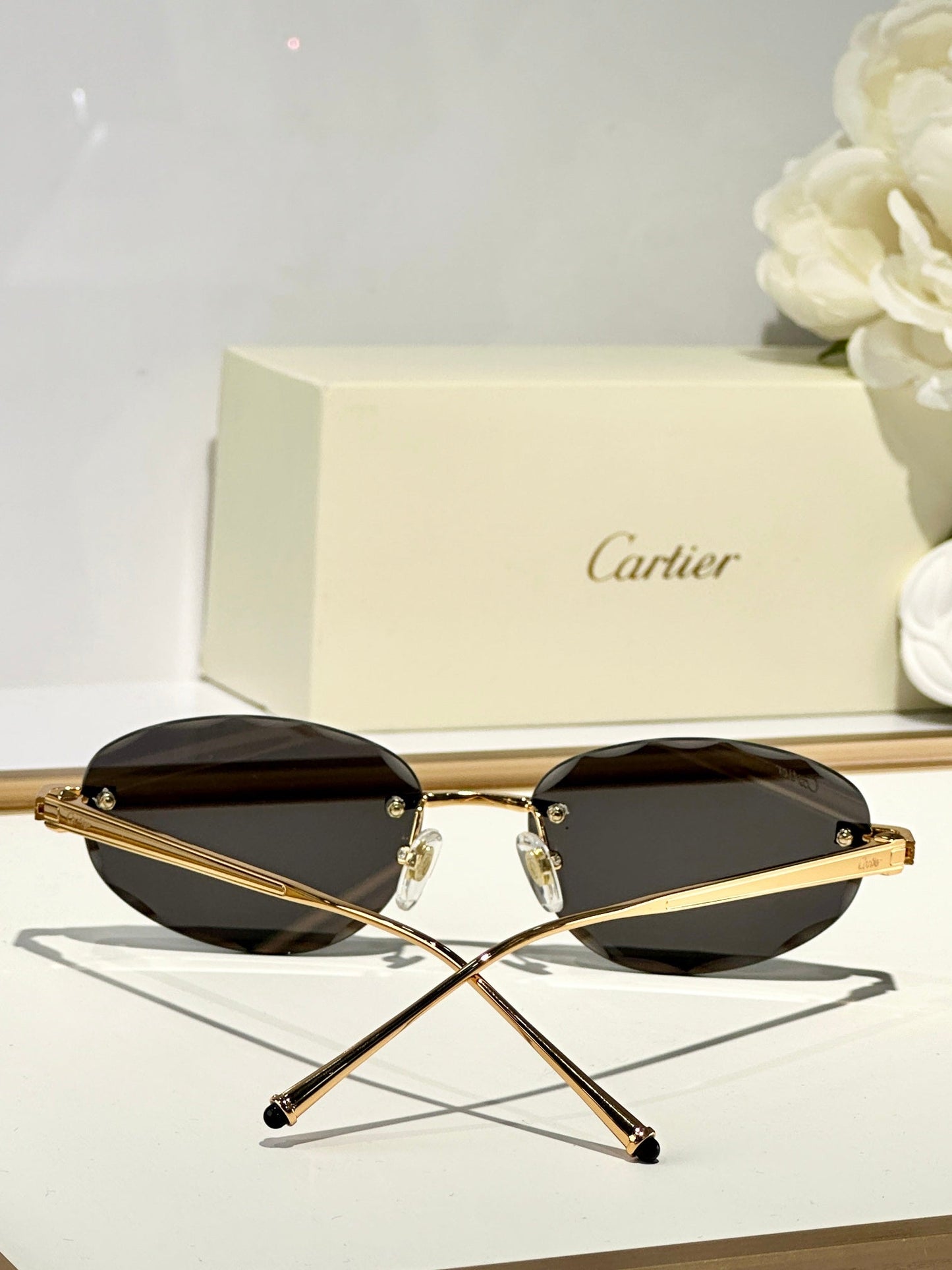 CARTIER RIMLESS ROUND FRAME SUNGLASSES CT0611S IN METAL