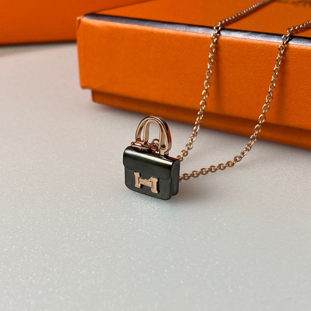 HERMES CONSTANCE BLACK PEDANT PINK GOLD NECKLACE