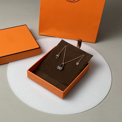 HERMES CONSTANCE BLACK PEDANT PINK GOLD NECKLACE