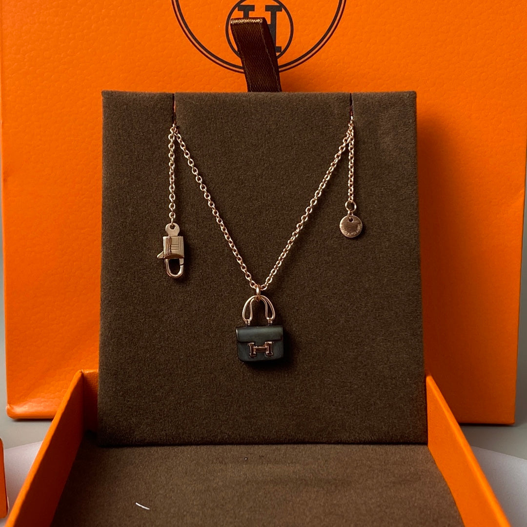 HERMES CONSTANCE BLACK PEDANT PINK GOLD NECKLACE