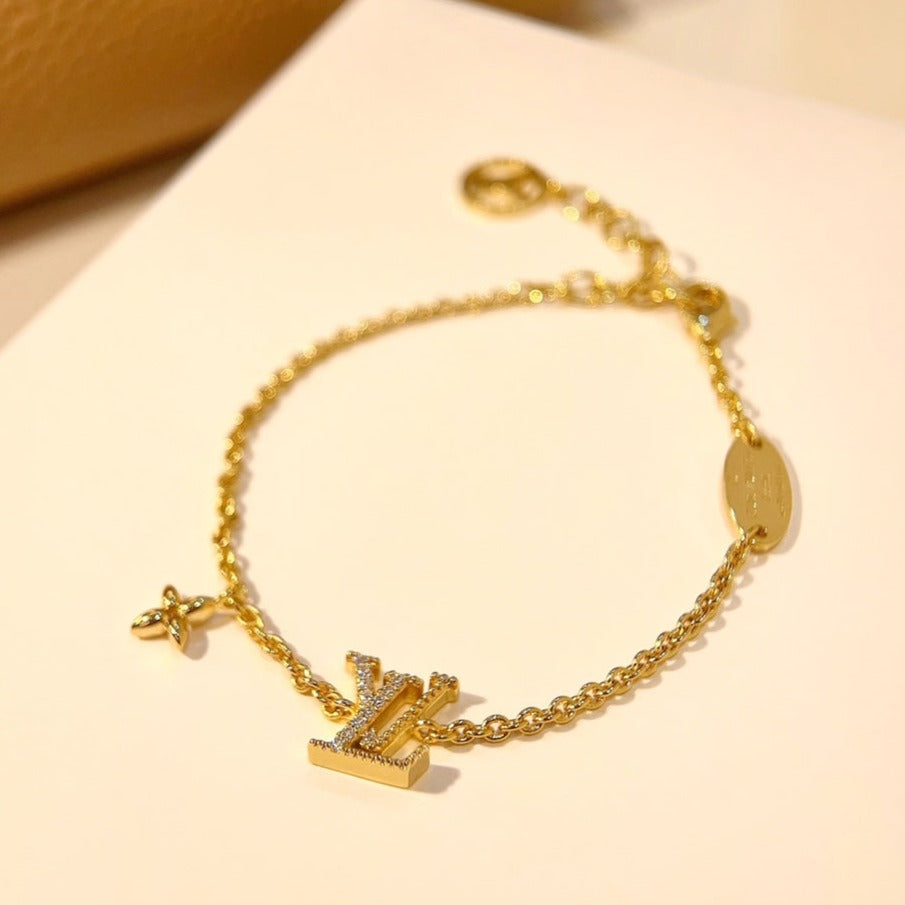 LOUIS VUITTON LOGO STAR MOTIF GOLD BRACELET