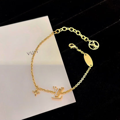 LOUIS VUITTON LOGO STAR MOTIF GOLD BRACELET