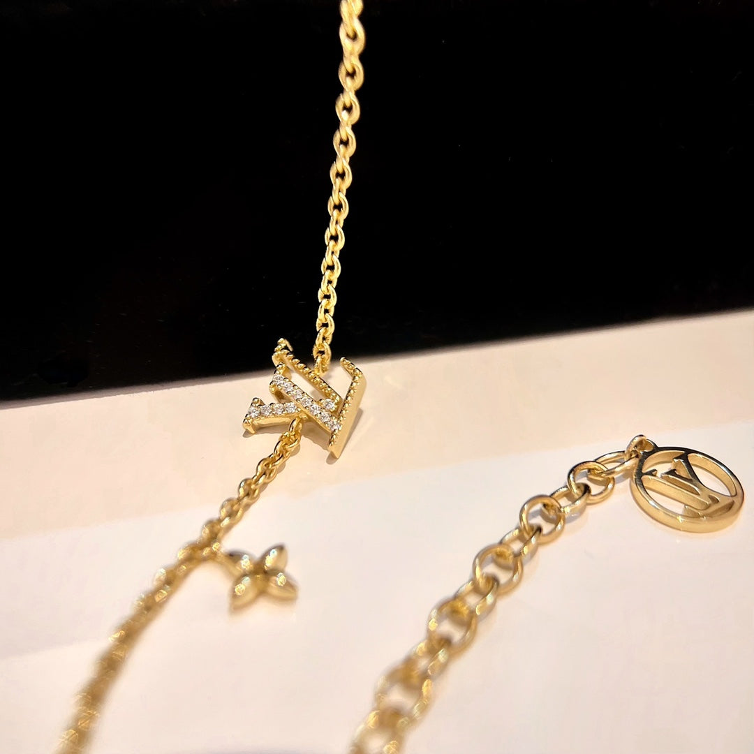 LOUIS VUITTON LOGO STAR MOTIF GOLD BRACELET