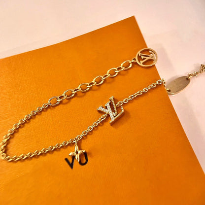 LOUIS VUITTON LOGO STAR MOTIF GOLD BRACELET