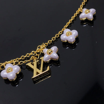 LOUIS VUITTON LOGO 6 MOTIF STAR AND SUN GOLD BRACELET