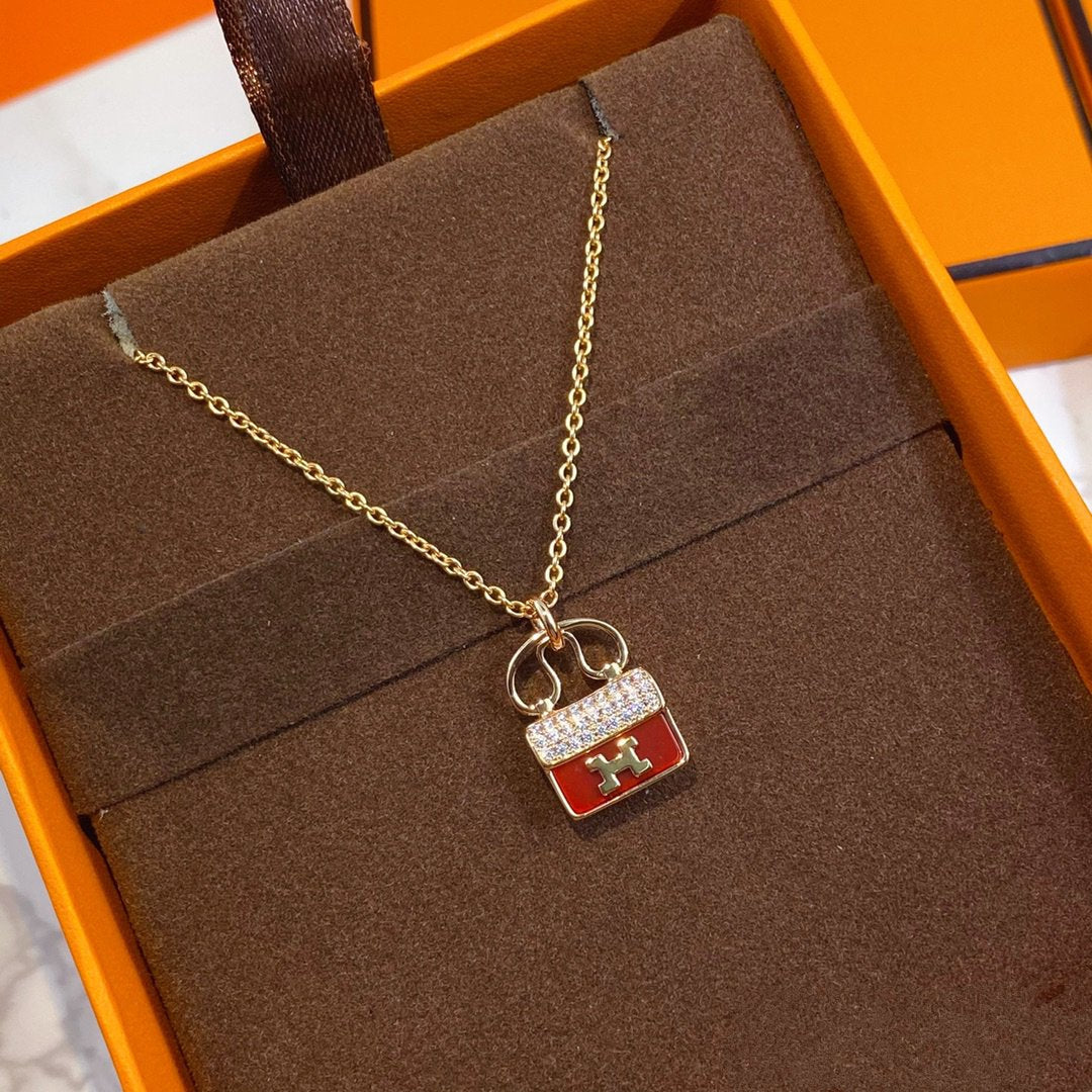 HERMES CONSTANCE RED PEDANT PINK GOLD NECKLACE