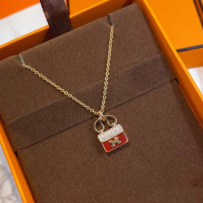 HERMES CONSTANCE RED PEDANT PINK GOLD NECKLACE