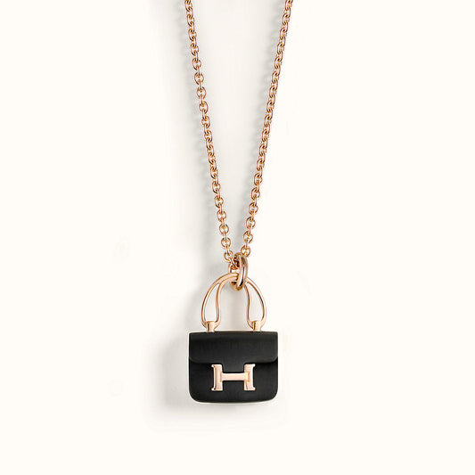 HERMES CONSTANCE BLACK PEDANT PINK GOLD NECKLACE