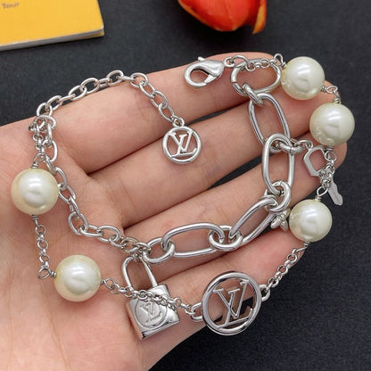 18K Louis Vuitton Pearl Lock Gold Bracelet