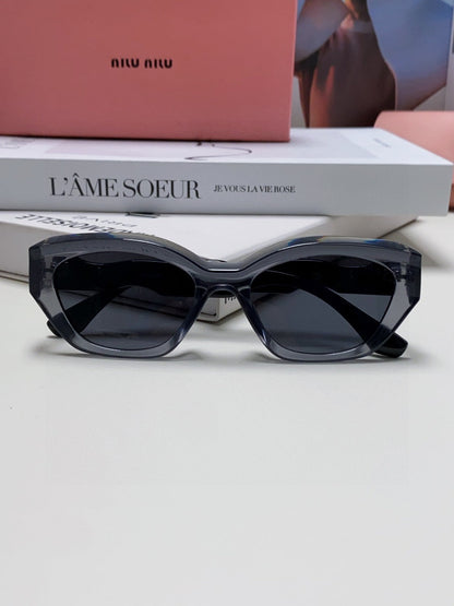 MIU MIU LOGO CAT EYE SUNGLASSES 513006 IN BLACK AND GREY CLEAR ACETATE WAVY FRAME