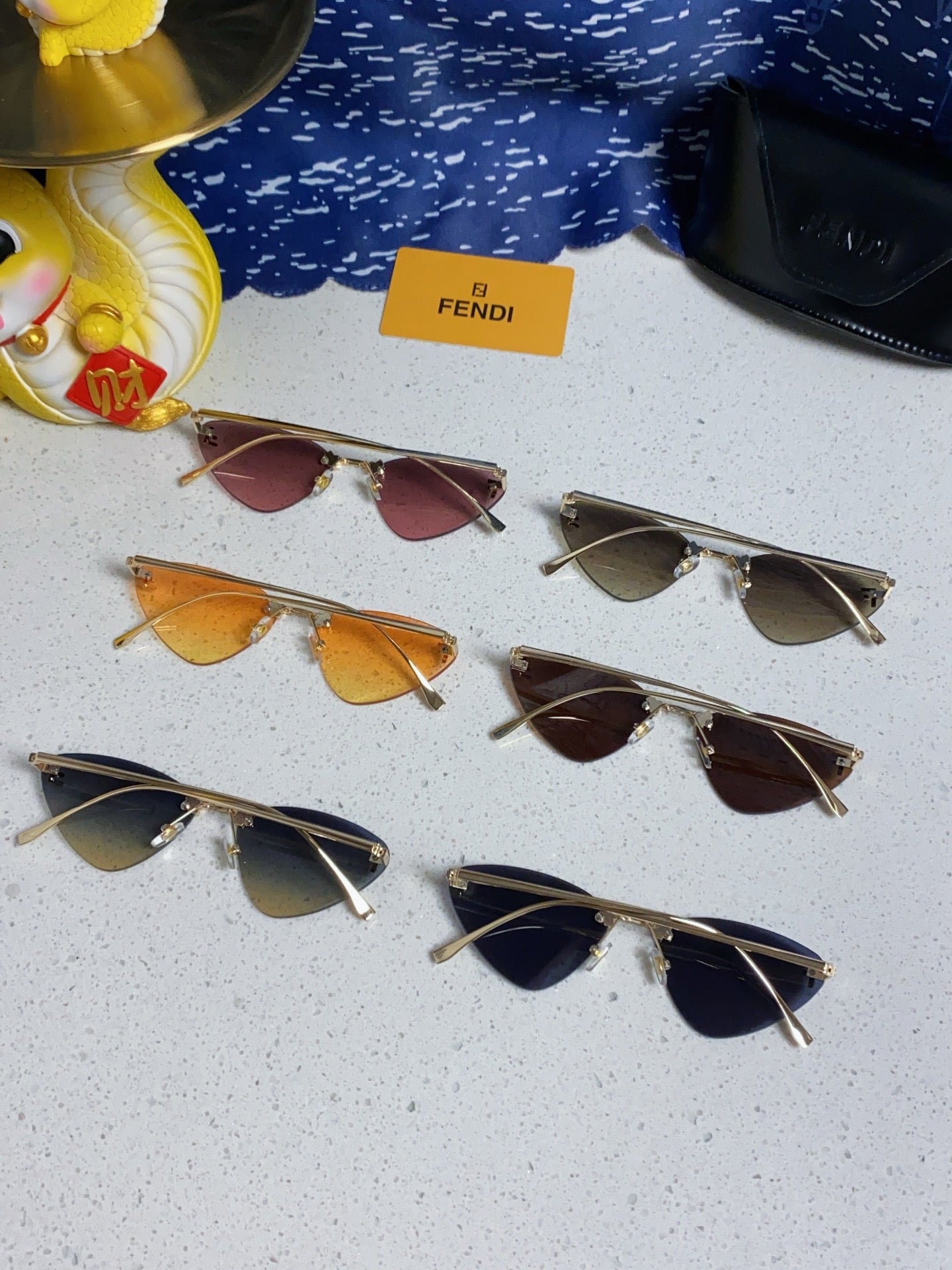 FENDI SKY RIMLESS TRIANGLE FRAME SUNGLASSES 566724 IN METAL
