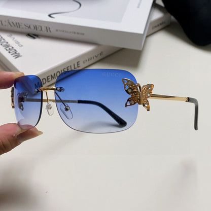 GUCCI BUTTERFLY EMBELLISHED RIMLESS RECTANGULAR FRAME SUNGLASSES 570245 IN METAL