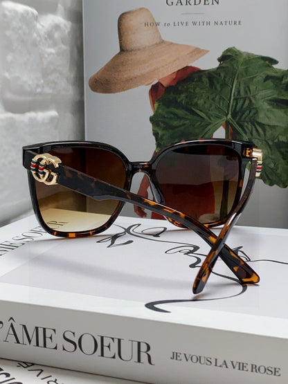 GUCCI EMBOSSED LOGO BUTTERFLY FRAME SUNGLASSES 576876 IN ACETATE