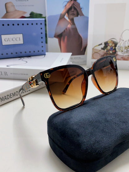 GUCCI EMBOSSED LOGO BUTTERFLY FRAME SUNGLASSES 576876 IN ACETATE