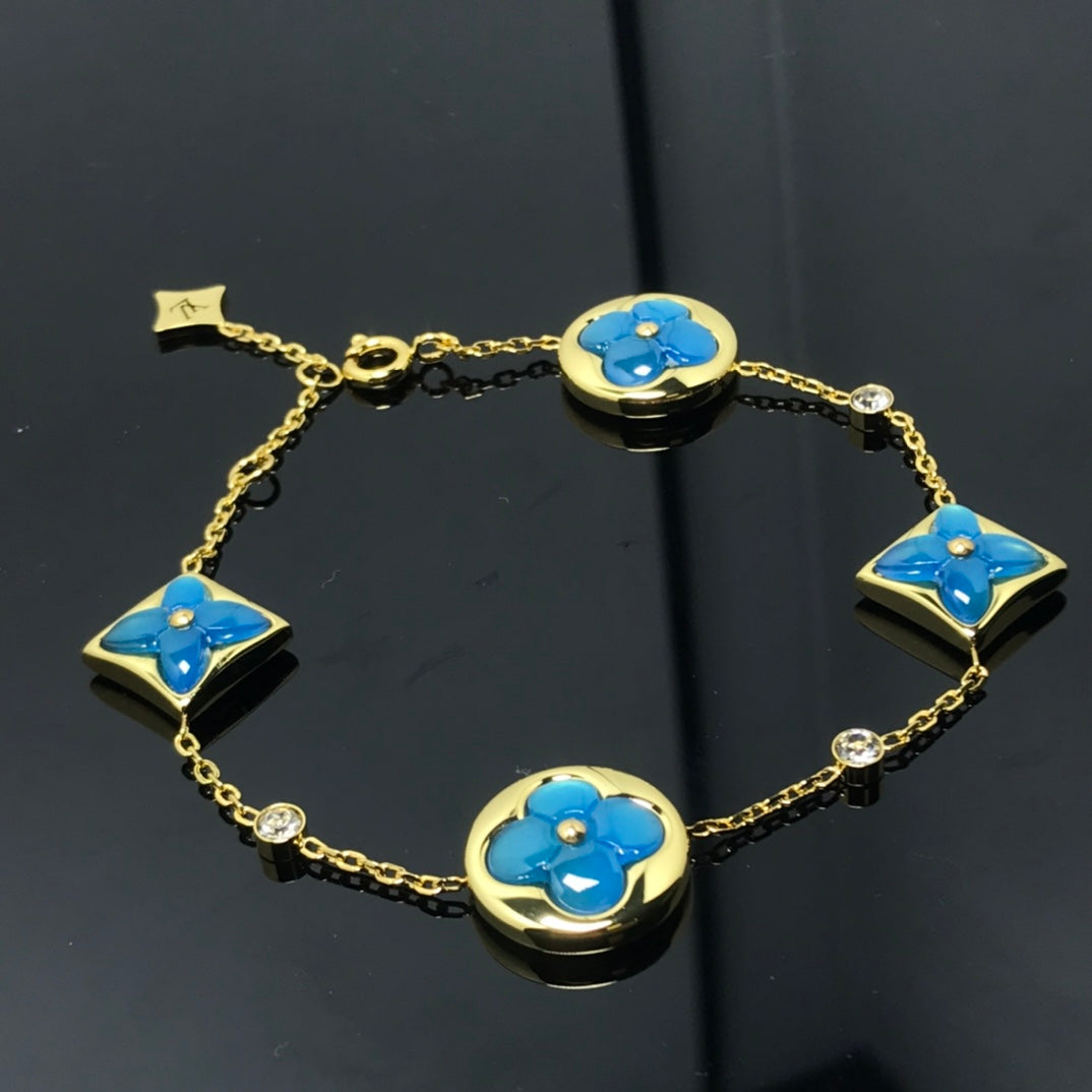 LOUIS VUITTON STAR AND SUN 4 MOTIF BLUE BRACELET